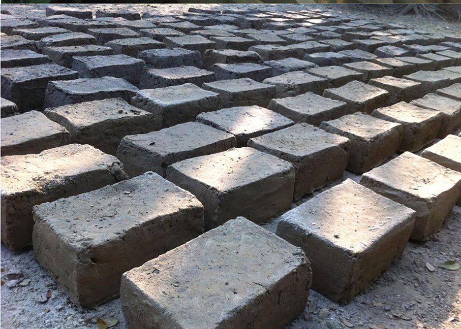 Women made the rammed earth blocks at home.