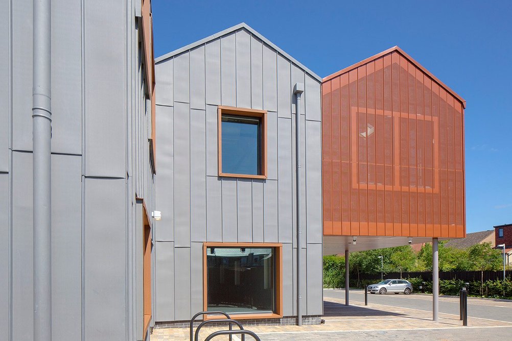 VM Zinc Quartz-Zinc Plus standing-seam facades and Pigmento orange perforated rainscreen cassettes at The Swiss Laundry offices, Cambridge, by PiP Architecture and MCW Architects.