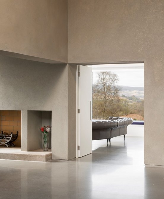 Fireplace in the snug and view through living room.