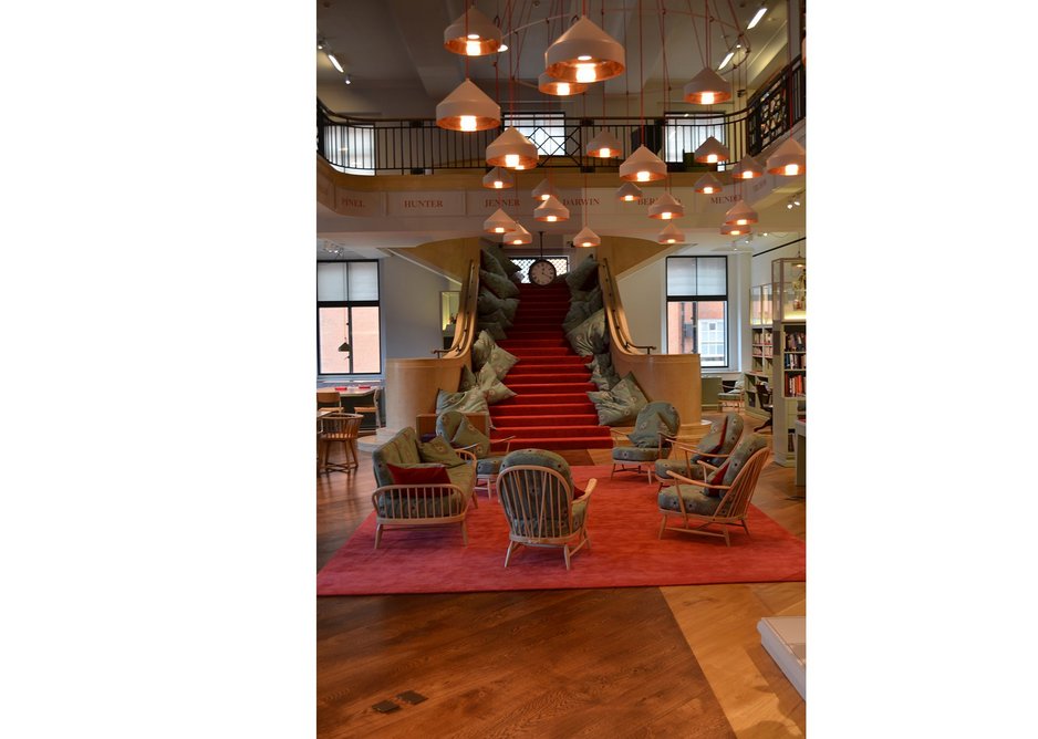 Stairs to nowhere - with no link to the library above, the stairs become informal auditorium seating with nice cushions.