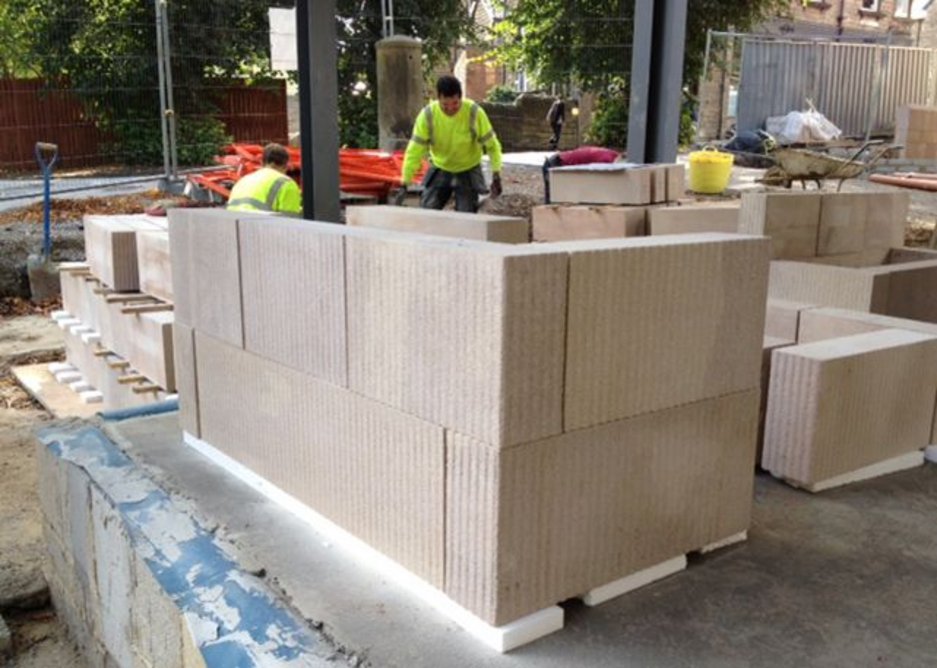 The solid locally sourced Derbyshire stonework arrives on site, ready-textured