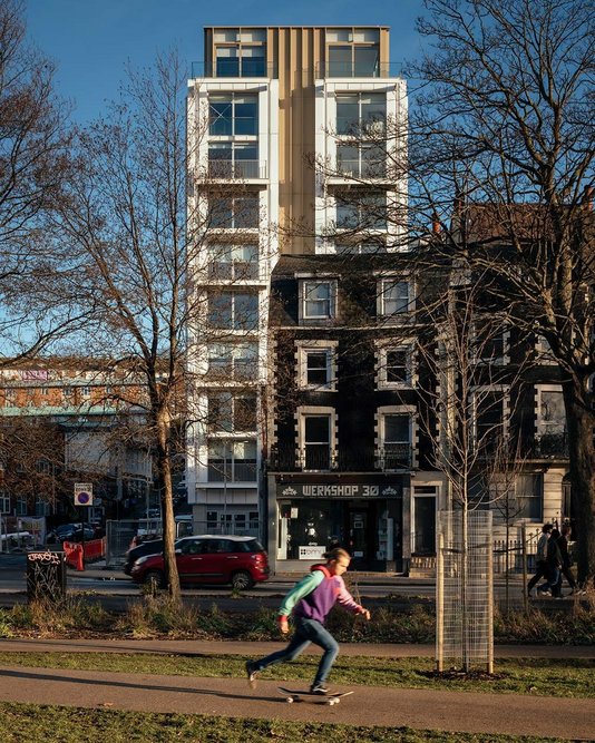 The private residential tower rises above the shops of Circus Street.