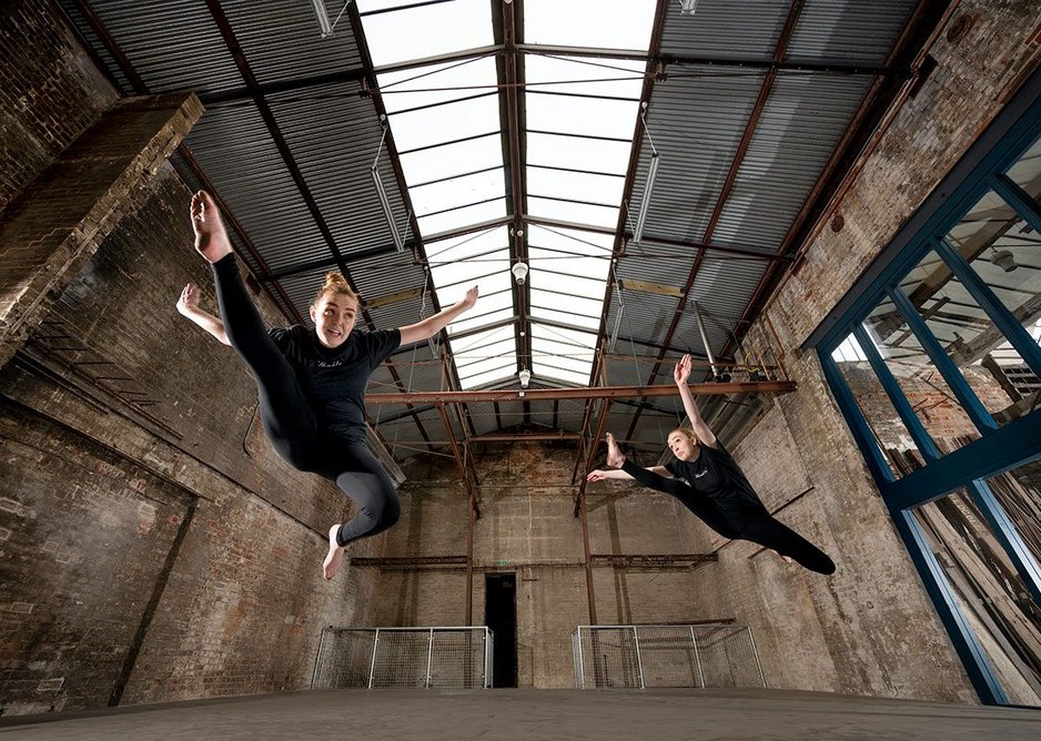 Treadgold’s former warehouse is now a multi-activity space as part of the new community centre.  Unrenovated spaces are visible through a window to the right.