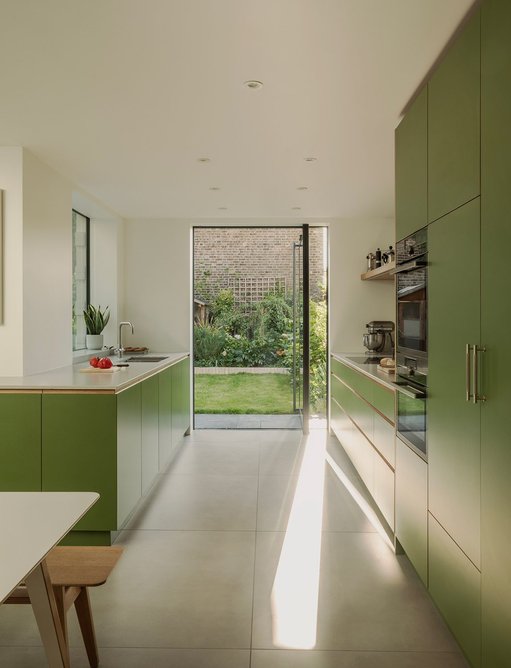 1.5m full-height openable pivot doors connect the kitchen to the garden.