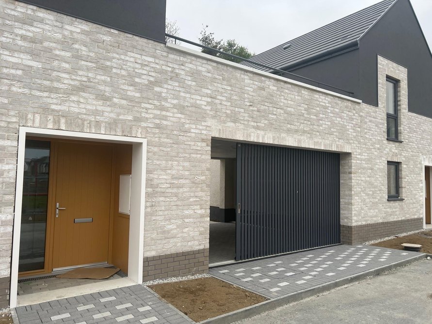 The 5.2 metre wide carport openings in the terraced houses were built without RSJs.