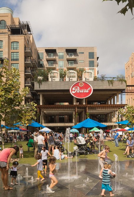 Everyday life unfolds in the transformed Pearl Brewery District.