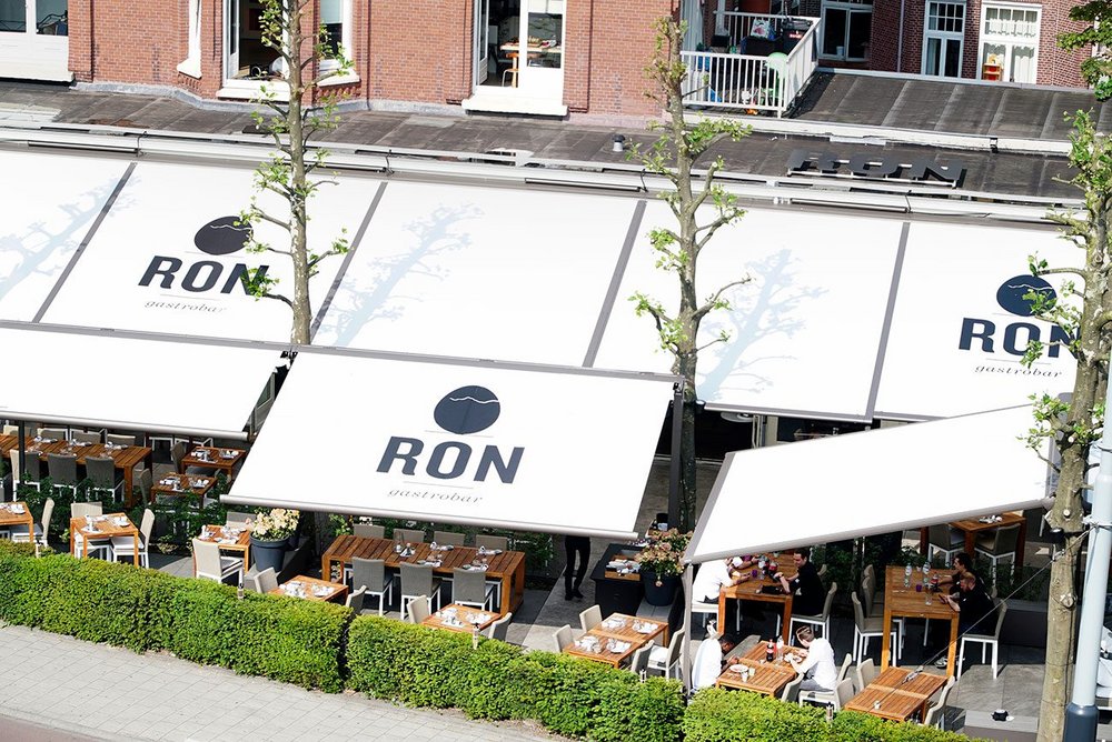 The Ron Gastrobar awning system keeps guests comfortable whatever the weather.