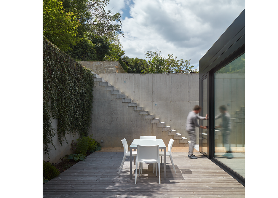 A terrace opens up at the rear of the house.