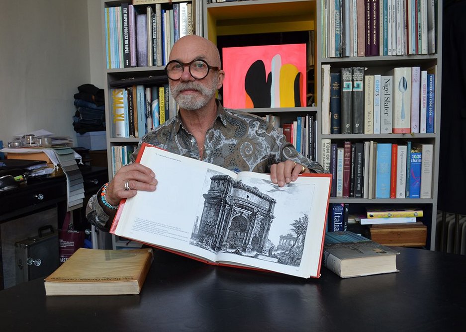 Coates with the Le Verdute di Roma open at Piranesi’s ‘View of the Arch of Septimius Severus’.