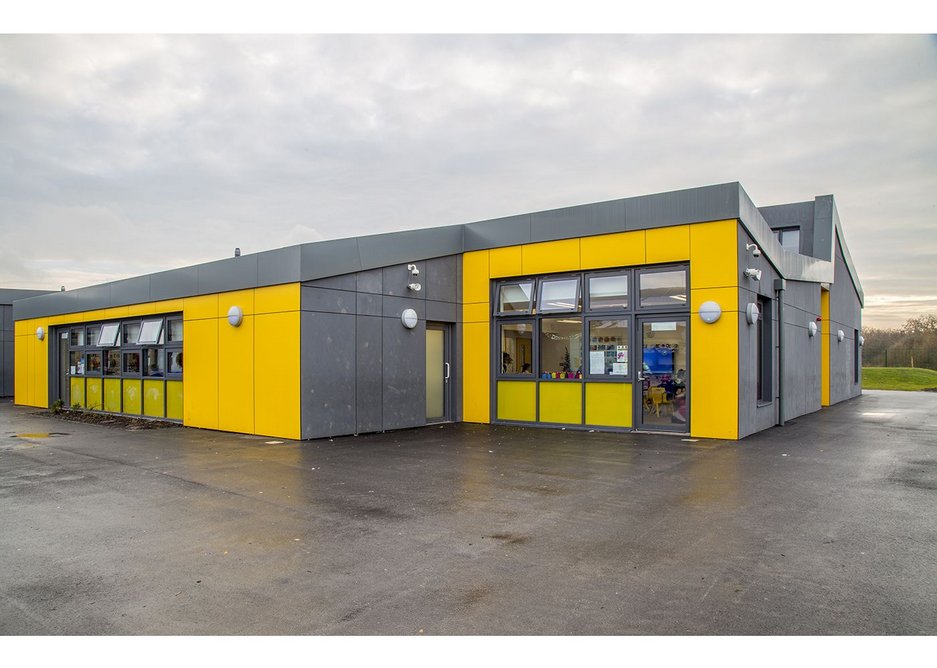 Yellow and grey Formica rainscreen cladding at Barrow Hall Primary School near Warrington, designed by Ellis Williams Architects.