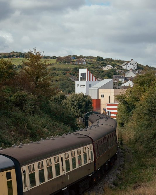 Angled roofs and bold stripes give tourists arriving on the West Somerset Railway steam train something to look for.