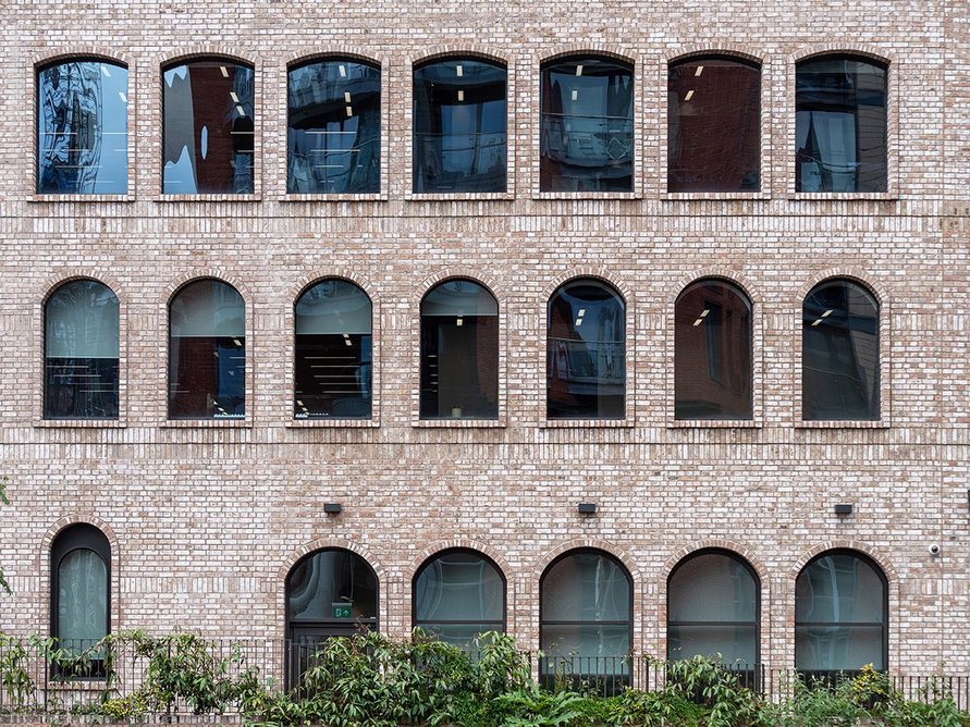 New reflects old: Large arched windows in the new southside extension reference those of the original building.