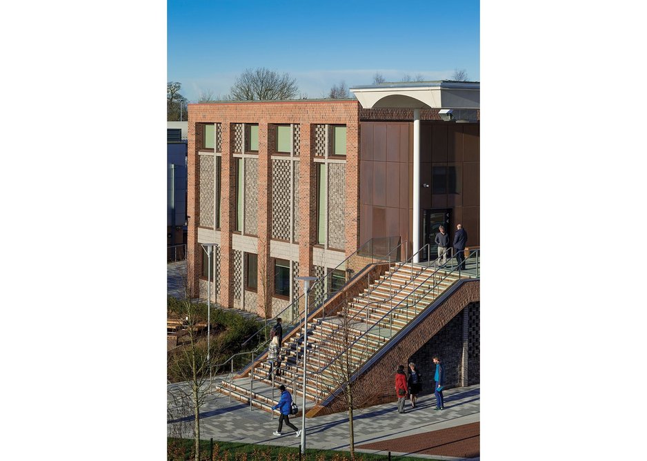 Side and rear elevations of the teaching block are exercises in textural and perforated brickwork.