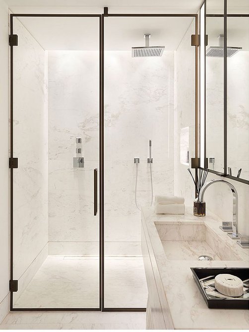 Show flat master ensuite, featuring Greek Galaxy floor and wall tiling from Campolonghi, and metal detailing to shower screen and cabinets.
