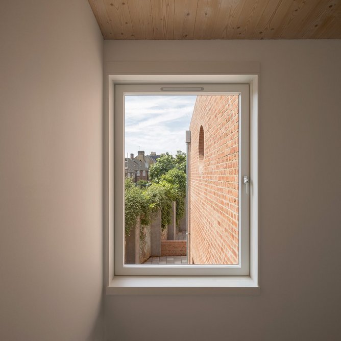 The side rear window at Chowdhury Walk, designed to minimise overlooking the existing houses behind.