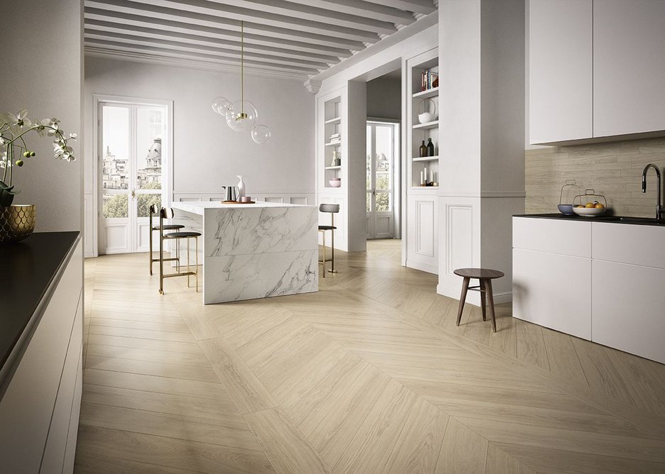 Kitchen and dining space with Anima Select Bianco Arabesco counter and Fabula Robur Chevron floor