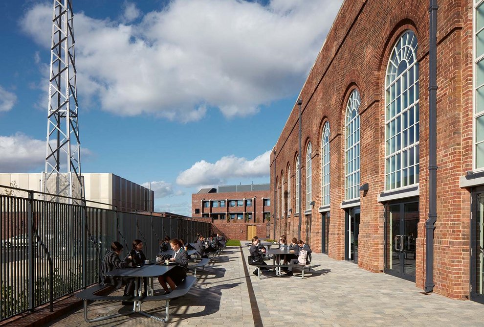 Lunch terrace outside the Power Hall, with the teaching block beyond and sports hall to the west.