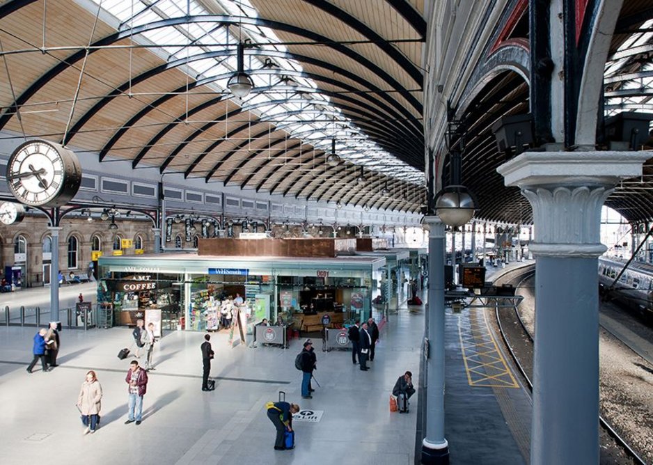 A tightly planned set of retail units taking the place of the ticket office. Lift gear is housed in the copperised boxes, among other things.