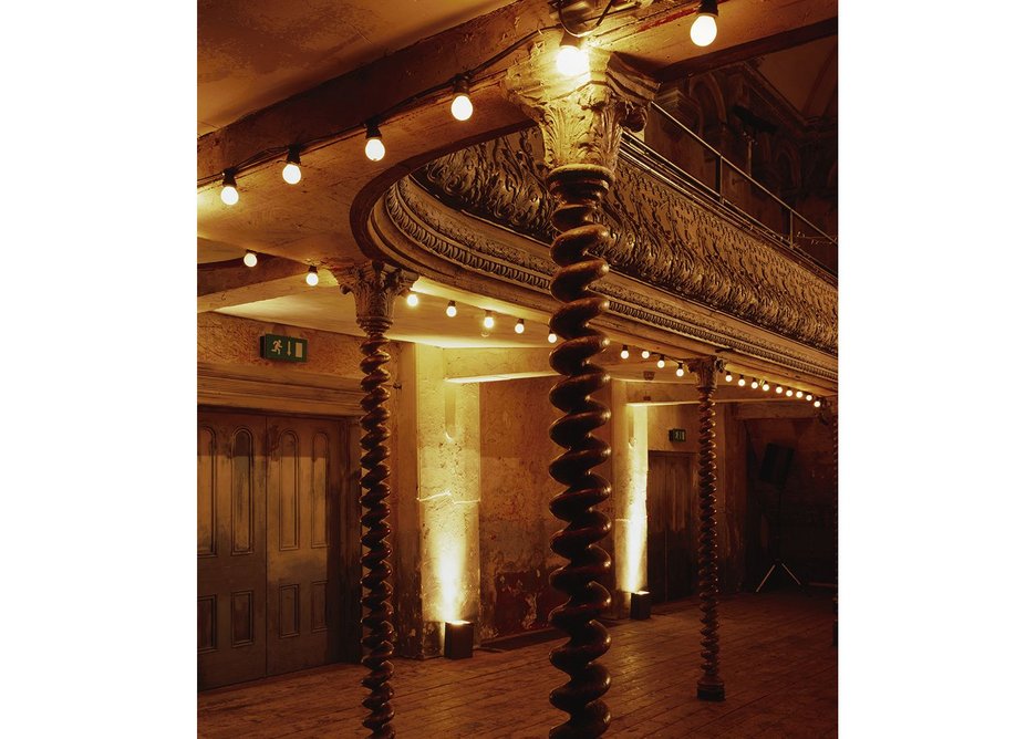 The auditorium with its coiling iron gallery columns is a very rare survival of the old East End.