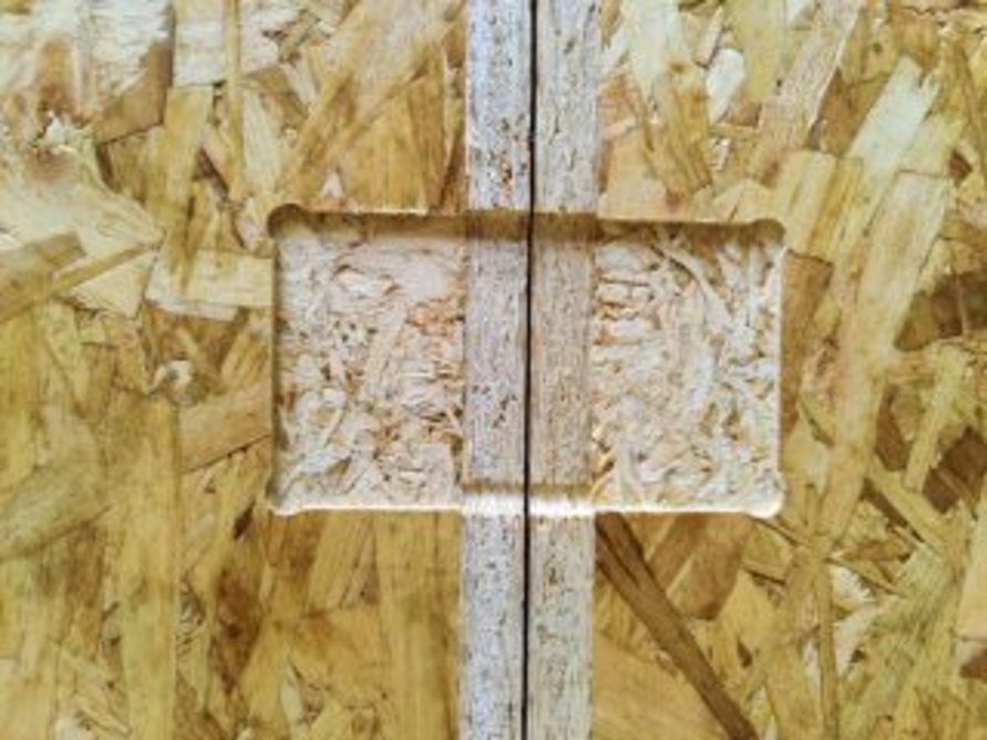 Nail plate positions are routed out of the OSB to ensure a flat surface.