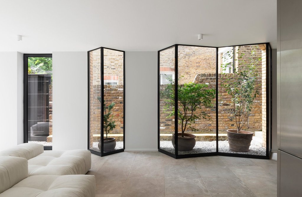 Glazing along two sides allows natural light deeper into the plan.