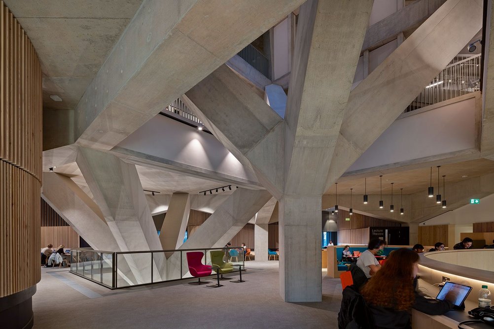 The structural trees grow up centrally past two floors of Harvard-style lecture spaces.
