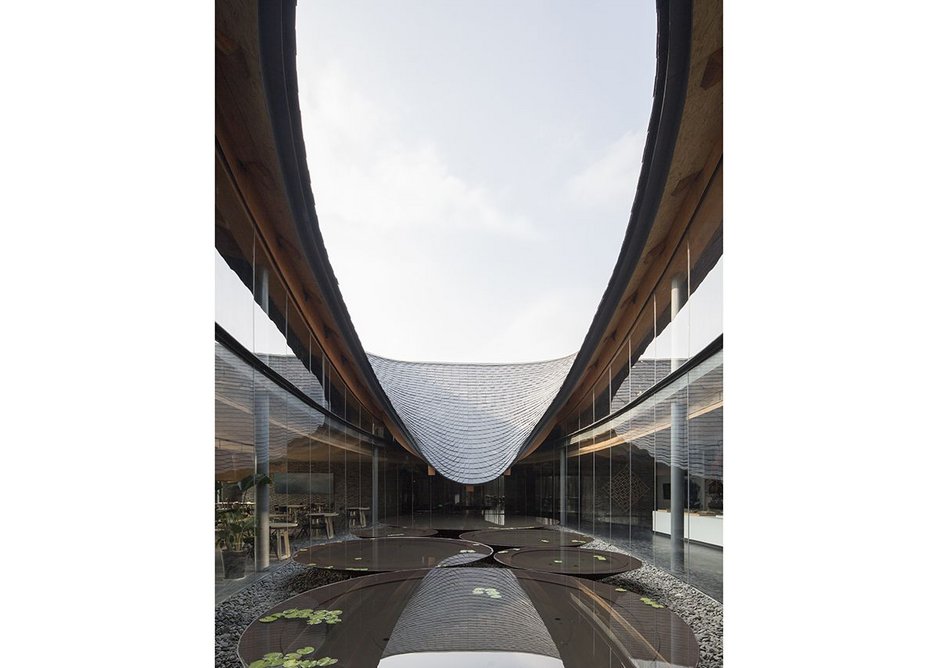 Inkstone House Cultural Centre, Sichuan Province, China (2018). A robotically controlled band-saw was again used to cut the beams, while sections of the brick wall were robotically prefabricated by Fab-Union.
