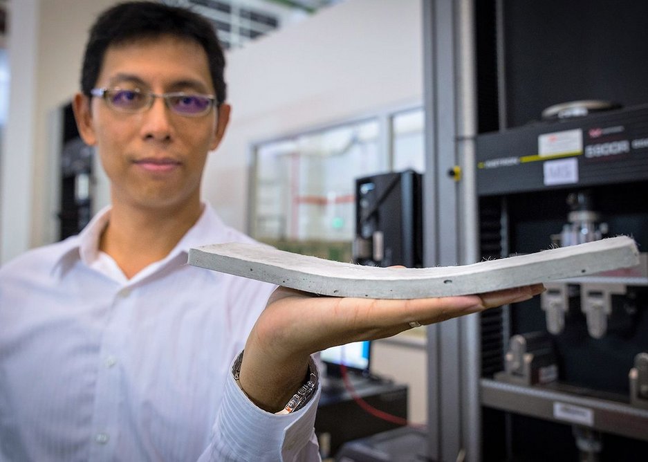 NTU Asst Prof Yang En-Hua holding the bendable concrete developed by his team.