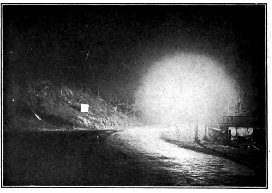 Glare is as much a matter of placement as absolute brightness.  Here, “serious glare” is created by a lamp placed at the curve of a country road, obscuring cars approaching from beyond the curve.   Preston Millar, “The Effective Illumination of Streets,” Transactions of the American Institute of Electrical Engineers 35 (June, 1915).