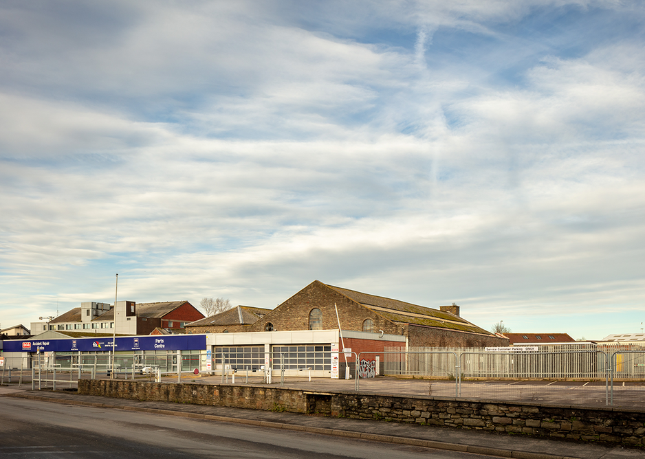 Empty parking lots of showrooms alongside the old coal sheds where the University of Bristol and AHMM envisage a new square.