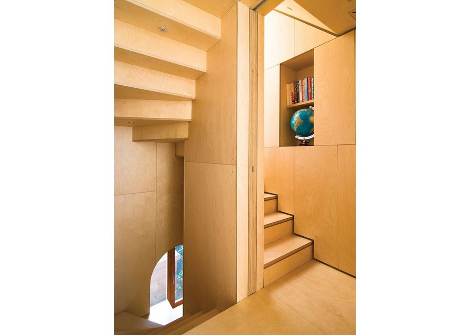 The plywood stair is at the heart of the building.