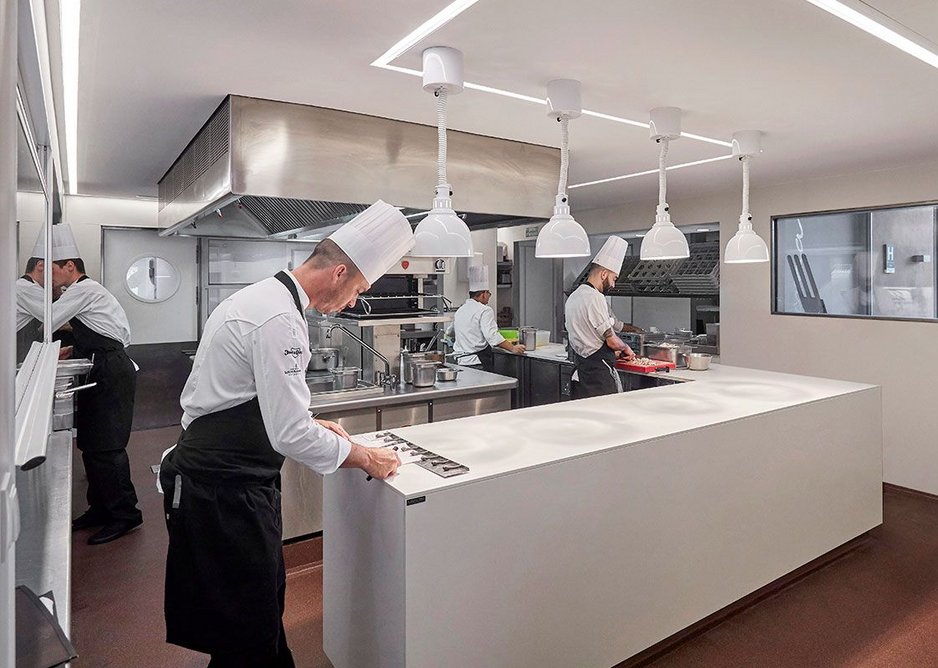 Action stations: worktops and walls in Neolith Nieve; floor in Neolith Iron Corten.