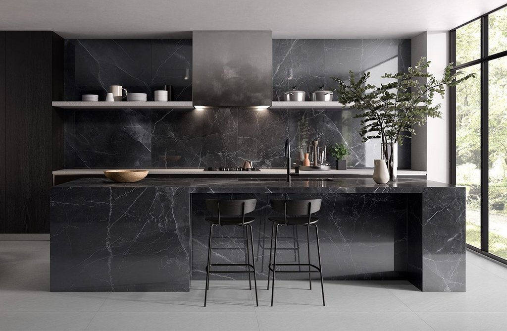 RAK Maximus Slab Amani Marble in dark grey shown used in a kitchen.