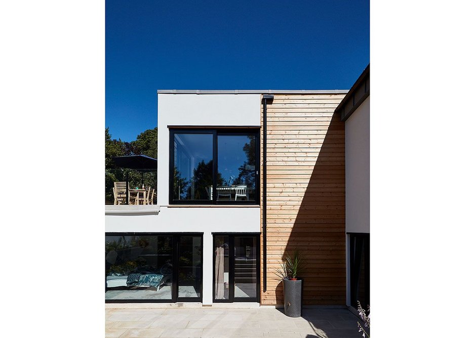 The Healthy House exterior is rendered with timber rainscreen cladding.