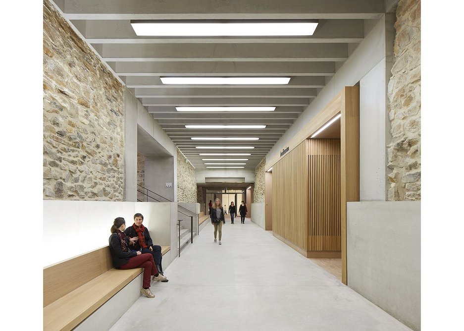 The basement has been excavated from between the foundations of the original building and made into a habitable space using concrete, oak and bronze.