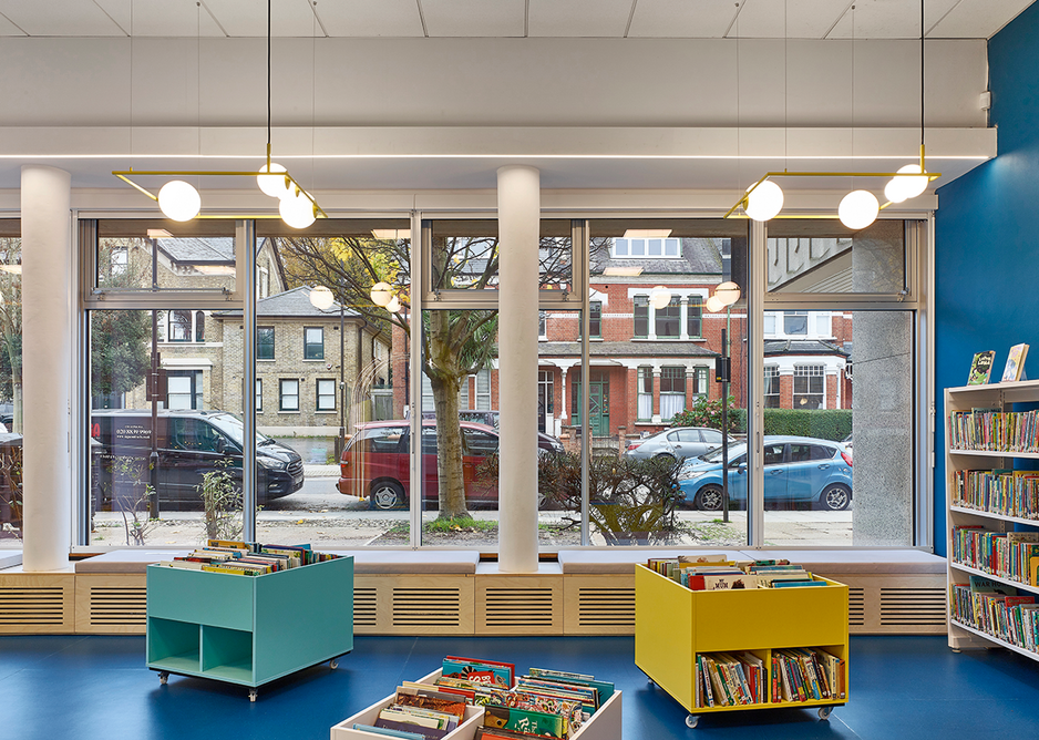 The children’s library with its new sunny entrance, colourful book bins, seating and flooring.