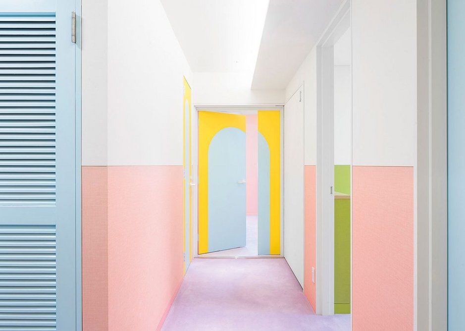 The white upper walls and ceiling divert attention from the necessary high level service runs.