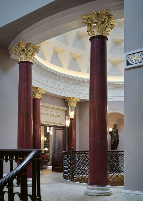 LED torchiere lamps on the staircases and upper foyer are programmed to imitate the ‘flicker’ of gaslight. Muse statue lamps are part of the emergency lighting strategy.