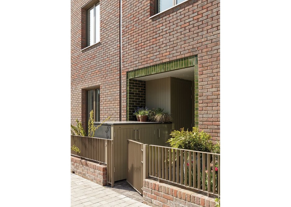 Green glazed bricks give entrances a qualitative component.