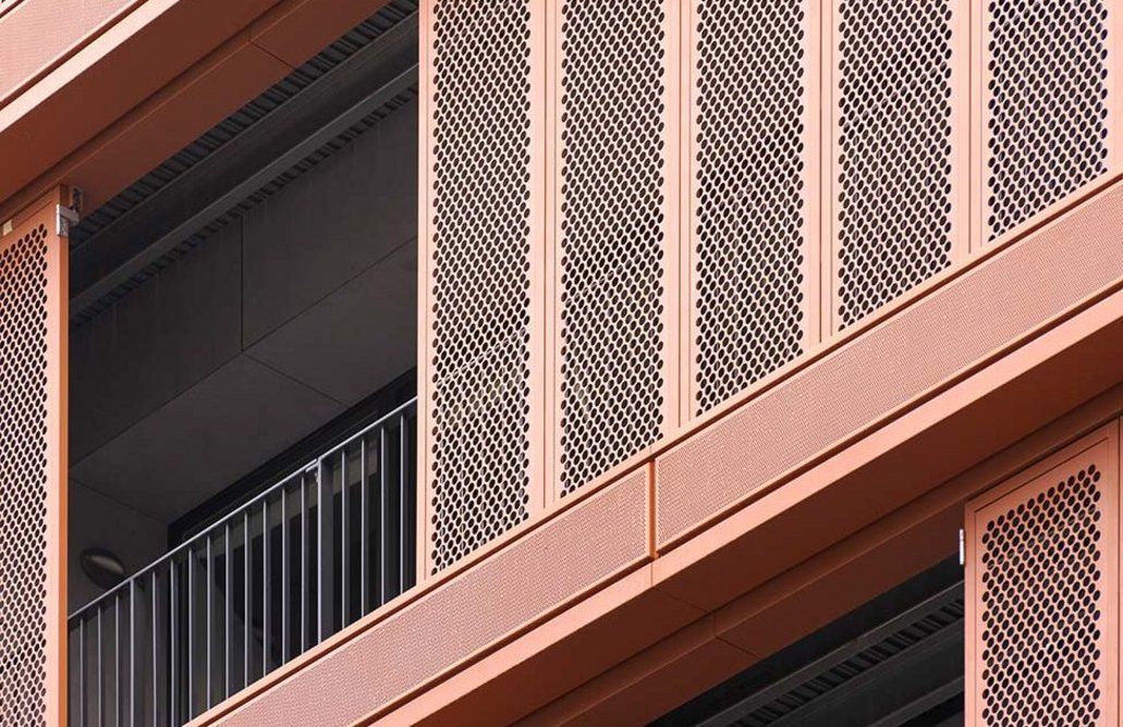 Anvil metal cladding: Perforated patterns enhance the shape of the building and create pleasing visual effects and plays of light.