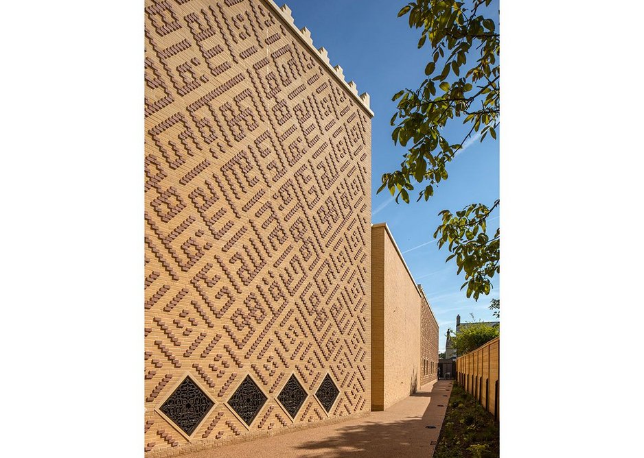 The exterior walls are faced in brick cladding hung from CLT timber panels. The brick has been chosen to reflect the light buff of Cambridgeshire gault brick, while being decorated with Arabic inscriptions in the Kufic style.