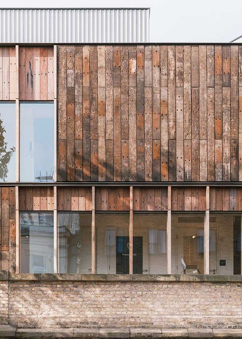 Reclaimed timber sleepers on the facade of Roundhouse Works in Camden, designed by Reed Watts Architects with Paddy Dillon Architect.
