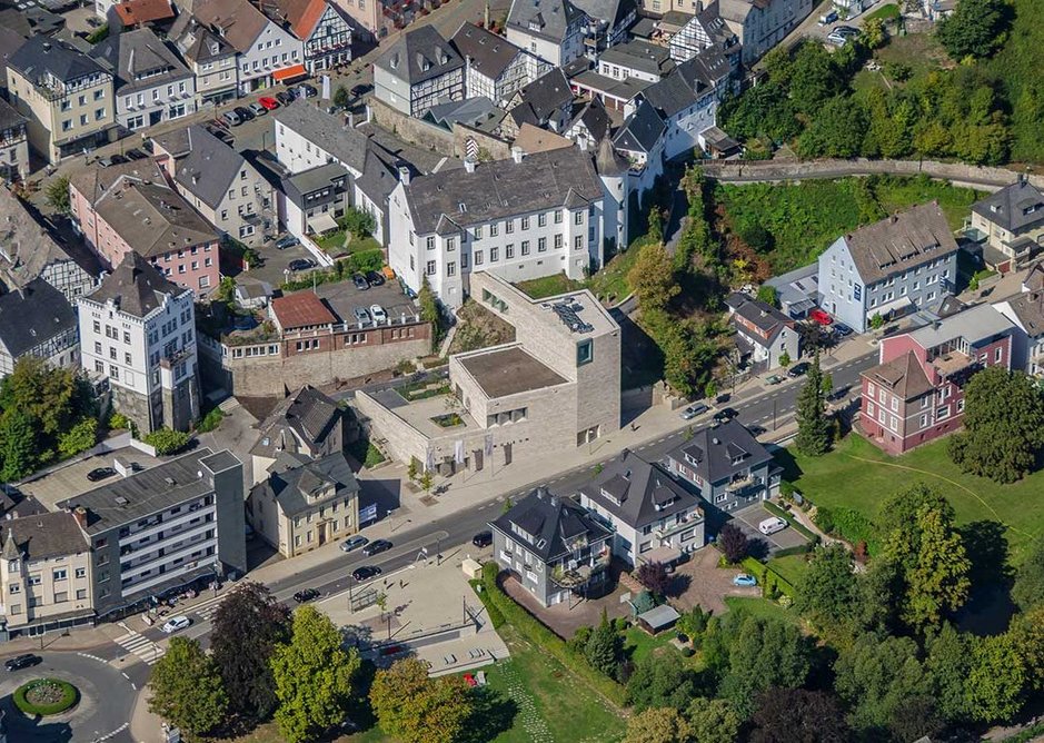 The museum mediates between the historic hilltop centre and newer parts of the town below and around it.