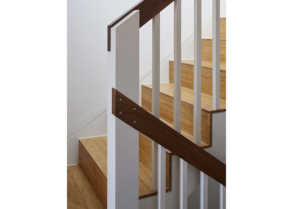 Details of post and banisters and in the treads lends an airy texture to the staircase.