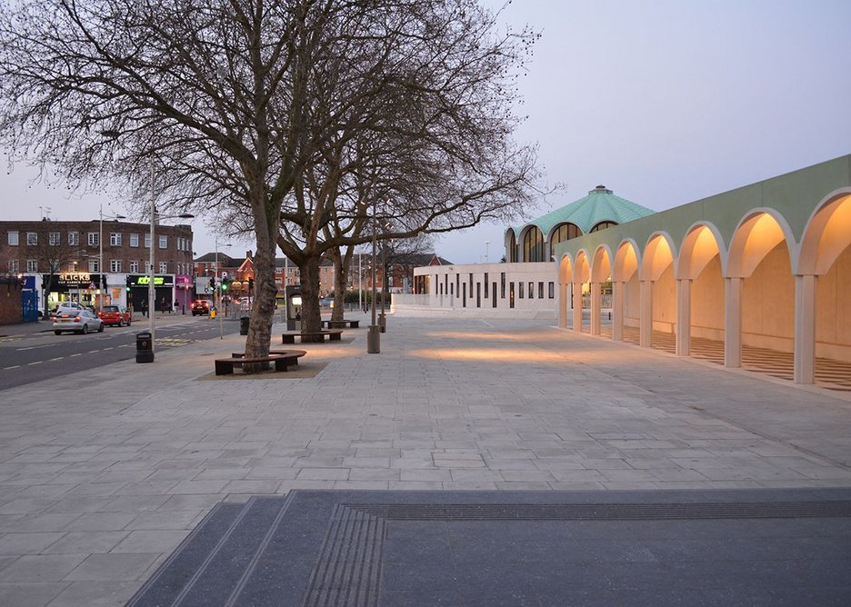 New town square, primed for events, includes existing trees.