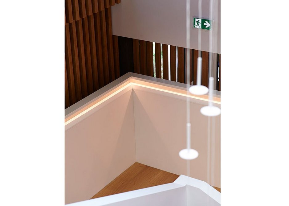 Handrail with recessed joints and angled lighting.