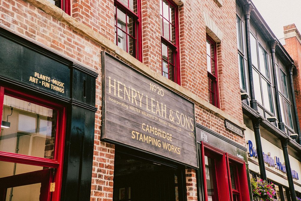 The original sign for Henry Leah & Sons’ Cambridge Street Stamping Works has been kept above the way in to Leah’s Yard.