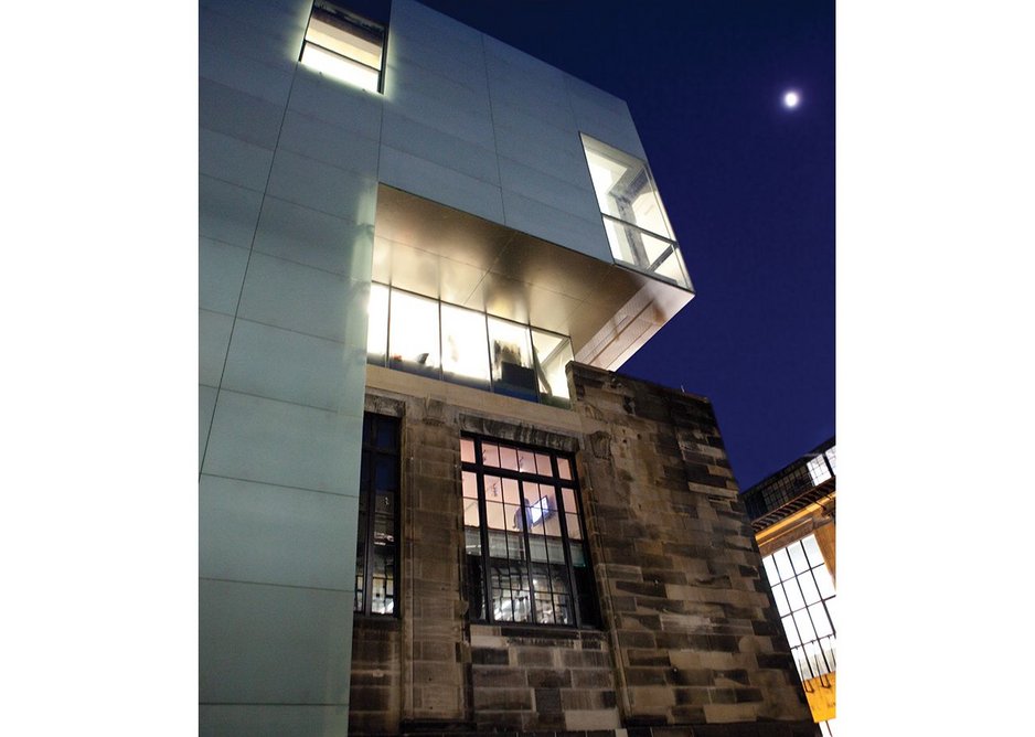 The crisp glazing of the new contrasts with the retained Assembly building.