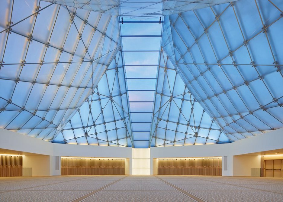 The chiselled white granite-clad form of Maki’s museum with auditorium and dome.