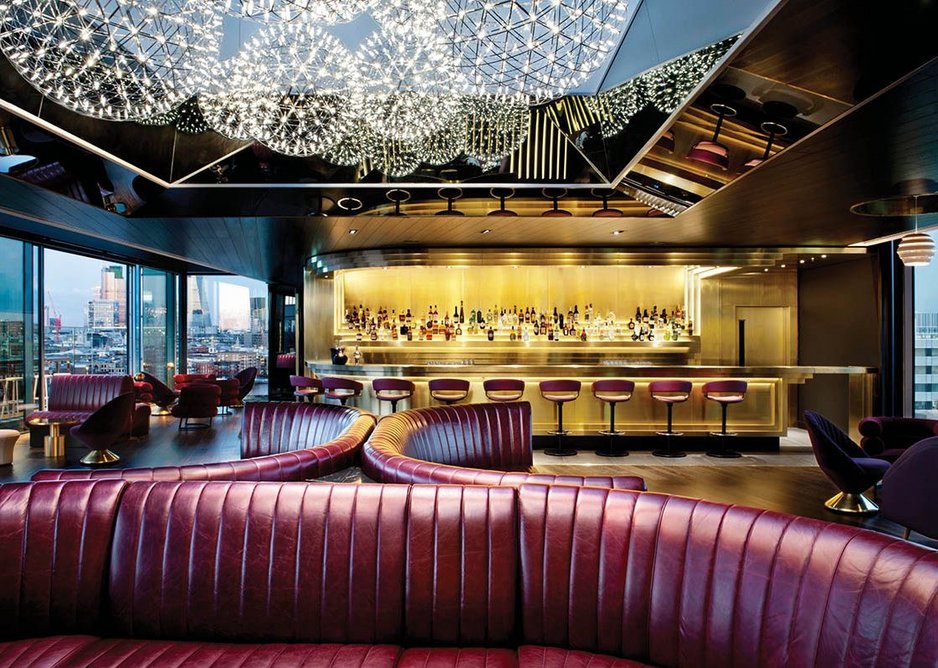 Pendants resembling firework explosions and sensuous red leather couches in the Rumpus Room bar on the roof.